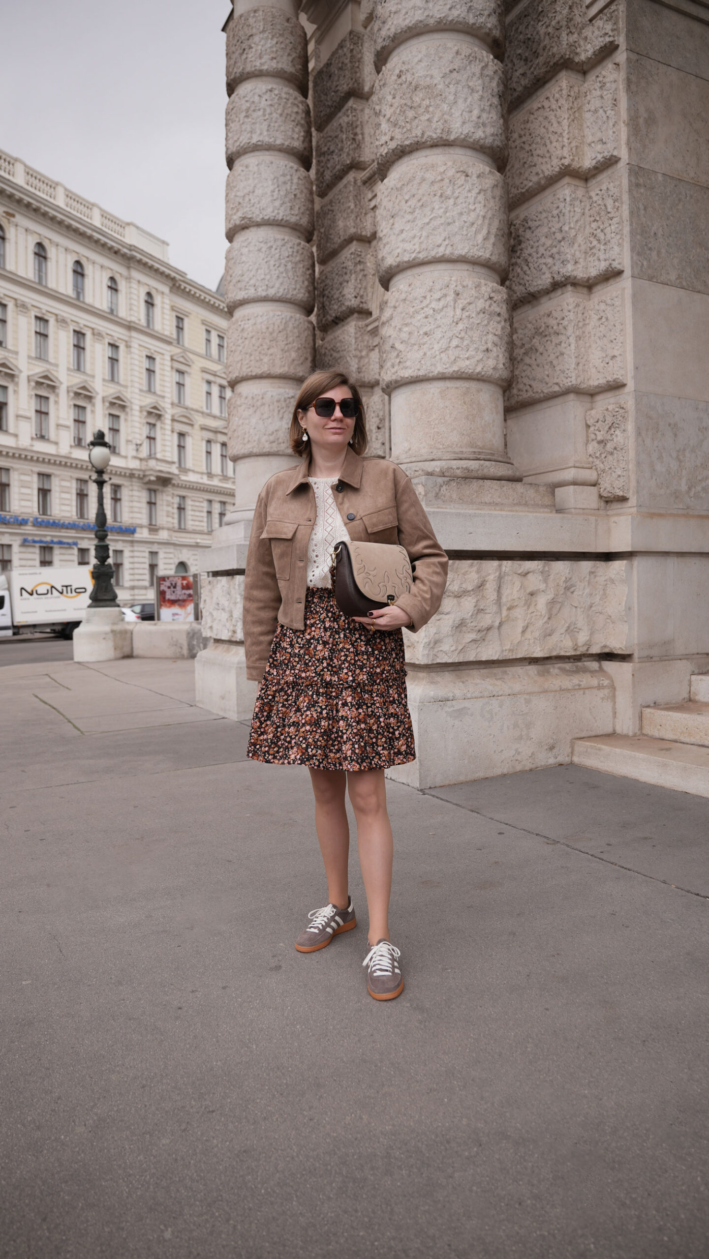 autumn outfit with brown leather jacket saaj skirt zoe lu bag sezane sweater adidas handball spezial sneakers